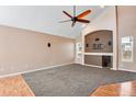 Living room with decorative nook and built-in entertainment center at 12535 Forest View St, Broomfield, CO 80020