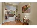 Elegant entryway featuring hardwood floors and views into the living room at 23426 Briar Leaf Ave, Parker, CO 80138