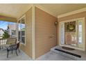 Inviting front porch with cozy seating, perfect for relaxing and enjoying the outdoors at 23426 Briar Leaf Ave, Parker, CO 80138