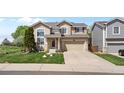 Charming two-story home with a well-maintained lawn and attached two-car garage, great curb appeal at 408 Sylvestor Trl, Highlands Ranch, CO 80129