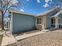 A charming home featuring beautiful stone accents and a well-maintained walkway, enhancing curb appeal at 31 Shetland Ct, Highlands Ranch, CO 80130