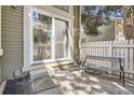 Cozy back patio with sliding glass door and space to relax outside at 14076 E Radcliff Cir, Aurora, CO 80015