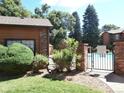 Gated entrance to community pool with lawn and trees in background at 2215 S Buckley Rd # 201, Aurora, CO 80013