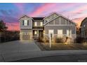 Charming two-story home with a well-manicured lawn at 21028 E Saratoga Ave, Aurora, CO 80015
