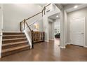 Spacious foyer with hardwood floors and a staircase at 21028 E Saratoga Ave, Aurora, CO 80015