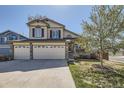 Charming two-story home with a three car garage and well-maintained lawn at 4708 Rock Pipit Ct, Highlands Ranch, CO 80126