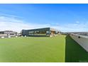 Expansive rooftop terrace boasts lush artificial turf, creating an inviting outdoor living space with city views at 5700 S Quebec St # A, Englewood, CO 80111