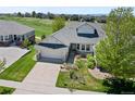 Aerial view of a home with a well-manicured lawn and a two-car garage in a desirable neighborhood at 7879 S Zante Ct, Aurora, CO 80016