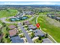 Aerial view of home in Primary-planned community, showing golf course, tennis courts and community center at 7879 S Zante Ct, Aurora, CO 80016