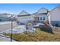 Ranch-style home with a neutral color palette, landscaping, and a two-car garage at 7879 S Zante Ct, Aurora, CO 80016