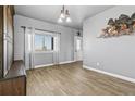 Charming dining room with tile flooring, a large window and view at 402 S County Road 129, Bennett, CO 80102