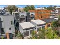 Aerial view of townhomes with attached garages and mountain views at 1256 Newton St # 1, Denver, CO 80204