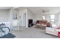 Comfortable living area with large windows and neutral carpet at 8917 E Chenango Ave, Greenwood Village, CO 80111