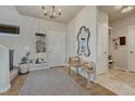 Bright foyer with hardwood floors and a unique wooden bench at 145 Kettle Valley Way, Monument, CO 80132