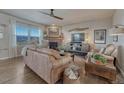 Comfortable living room with stone fireplace and mountain views at 145 Kettle Valley Way, Monument, CO 80132