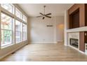 Sunlit living room boasting large windows and hardwood floors at 5137 Mt Arapaho Cir, Frederick, CO 80504