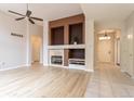 Bright living room with fireplace, hardwood floors and an open floor plan at 5137 Mt Arapaho Cir, Frederick, CO 80504