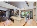 Modern kitchen with a large island, stainless steel appliances, and open floor plan, perfect for cooking and entertaining at 9470 S Silent Hills Dr, Lone Tree, CO 80124