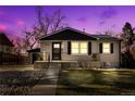 Charming house exterior at dusk, showcasing updated facade and landscaping at 3939 S Huron St, Englewood, CO 80110