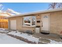 House exterior showcasing entryway and garage at 4070 W Dartmouth Ave, Denver, CO 80236