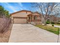 Charming single-Gathering home with a two-car garage, covered porch, and well-manicured lawn at 5162 Hubert St, Parker, CO 80134