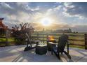 Enjoy outdoor relaxation on the patio, complete with a fire pit and seating at 16701 Buffalo Run Dr, Commerce City, CO 80022