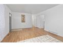 Bright living room showcasing hardwood floors and a neutral color palette at 5562 Anaheim Way, Denver, CO 80239