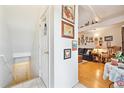 Welcoming entrance featuring bright walls adorned with art and a glimpse into the cozy living space at 2846 W Centennial Dr # E, Littleton, CO 80123