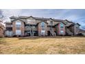 Attractive condo community with well-maintained lawn and inviting exteriors with stone accents at 2846 W Centennial Dr # E, Littleton, CO 80123