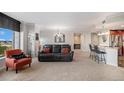 Comfortable living room features neutral tones, carpet, and a view of the city at 8100 E. Union Ave # 409, Denver, CO 80237