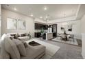 Inviting open-concept living room with stylish furnishings adjacent to the modern kitchen and dining area at 350 High Point Dr # C201, Longmont, CO 80504