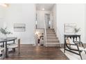 Bright hallway with modern decor leads to the upper level bedrooms and basement at 10275 Quail St, Westminster, CO 80021