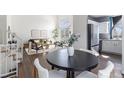 Open-concept living and dining area with hardwood floors and natural light at 10275 Quail St, Westminster, CO 80021