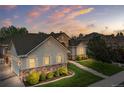 Charming home exterior with stone accents, a well-manicured lawn, and a welcoming entrance at 14310 Inca St, Westminster, CO 80023