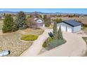 Two-story home with a detached oversized garage, set on a spacious lot with mature trees at 2610 W County Road 4, Berthoud, CO 80513