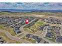 Aerial view of a Primary-planned community with mountain views at 6521 Barnstead Dr, Castle Pines, CO 80108