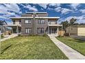 Contemporary duplex boasting a neat lawn and walkway at 2008 Galapago, Denver, CO 80223