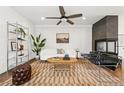Cozy living room featuring a stylish rug, modern furniture, and ample natural light at 3941 Vallejo St, Denver, CO 80211