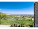 Expansive backyard offering picturesque views and vibrant flowerbeds for a serene outdoor experience at 6980 Fargo Trl, Littleton, CO 80125