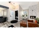 Entryway with bench, coat closet and fireplace at 6980 Fargo Trl, Littleton, CO 80125