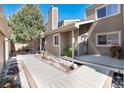 Exterior view showcasing a well-maintained home with a lovely deck and manicured landscaping at 6980 Fargo Trl, Littleton, CO 80125