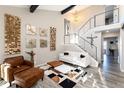 Inviting living room featuring modern decor and a staircase with metal railings at 6980 Fargo Trl, Littleton, CO 80125