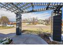 View of a cozy covered front porch with decorative flower pot and view of the neighborhood at 7240 S Cherry Dr, Centennial, CO 80122