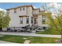 Beautiful home exterior with a well maintained yard and stone accents on the facade at 15218 W La Salle Ave, Lakewood, CO 80228