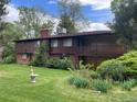 Large two-story home with a spacious backyard and a second-story balcony at 12075 W 18Th Dr, Lakewood, CO 80215