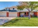 Brick townhouse with attached garage and landscaping at 4618 S Newton St, Denver, CO 80236