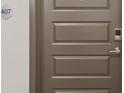 Modern apartment entry door with keyless entry at 487 Interlocken Blvd # 407, Broomfield, CO 80021