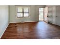 Inviting living room featuring hardwood floors and a view of the outdoors through a window and door at 7195 E Louisiana Ave, Denver, CO 80224