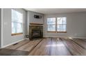 Living room with corner fireplace and tile floors at 1869 S Union Blvd, Lakewood, CO 80228