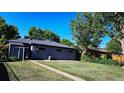 Spacious backyard with lush green lawn, perfect for outdoor activities and relaxation at 5567 E Asbury Ave, Denver, CO 80222